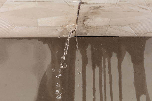 Professional Flood Damage Cleanup technician working in Akron, NY
